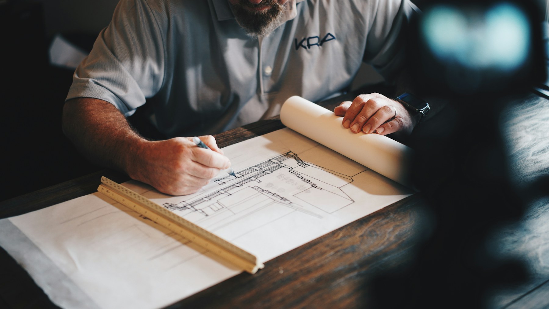 Contractor crew reviewing plans at a construction site